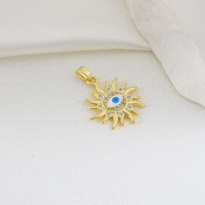 Detailed view of evil eye sun pendant with blue enamel and sparkling zircons