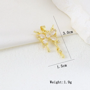 Close-up of gold butterfly pendant with cubic zirconia detailing and dimensions