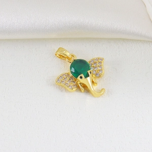 Golden elephant pendant featuring a large green zircon stone and sparkling white accents
