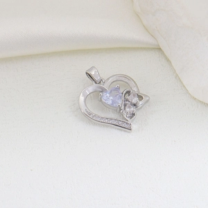 Detailed view of silver heart pendant with purple gemstone and cubic zirconia accents