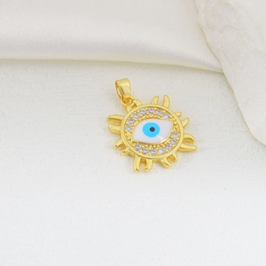 Close-up of gold evil eye sunburst pendant with blue zircon stones on white silk