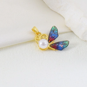 Elegant gold butterfly pendant with a central pearl and colorful gradient wings