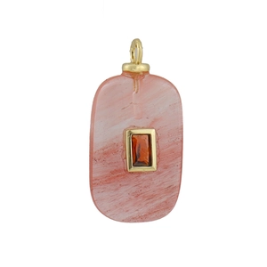 Close-up of a pink quartz-style rectangular pendant with orange gemstone and gold clasp
