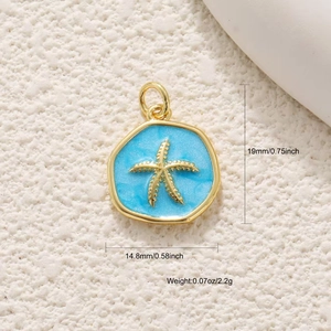 Detailed view of 18K gold starfish charm pendant with blue enamel and dimensions