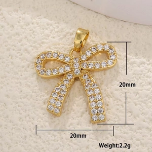 Detailed view of gold copper butterfly pendant with micro-pave zircons and dimensions