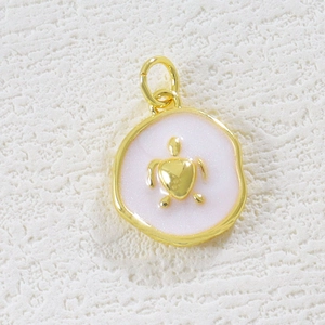 Detailed macro view of 18K gold plated turtle pendant with white enamel base inlay