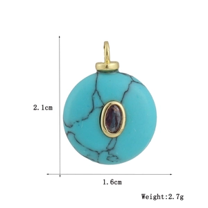Detail showing dimensions of 2.1cm by 1.6cm for the turquoise and copper pendant