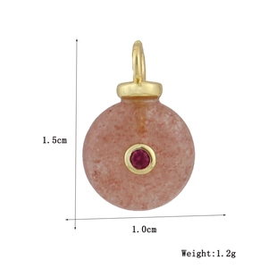 Detail view of pink stone pendant with gold bail and red gem including size dimensions