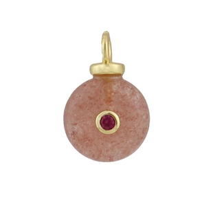 Close-up of pink natural stone pendant with a red gemstone inset in gold setting
