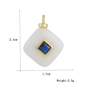 Detail shot showing 2.1cm x 1.7cm square turquoise pendant dimensions and 2.5g weight