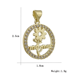 Detailed view of mama gold pendant with zircons showing dimensions 2.5cm by 1.8cm