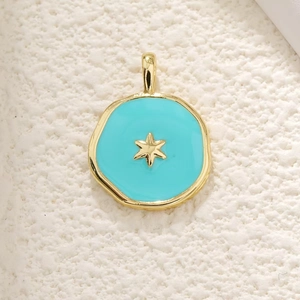 Detailed view of the 18K gold plated celestial star pendant with blue enamel infill