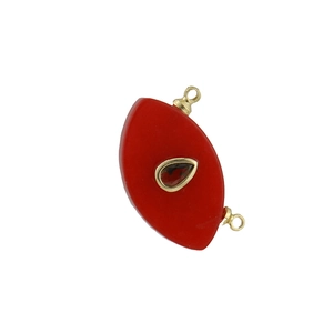 Detailed view of red eye-shaped copper pendant with rhinestones for DIY jewelry making