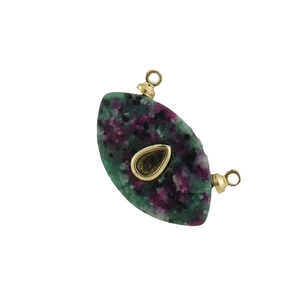 Macro detail of Ruby in Zoisite pendant with gold-rimmed gemstone and dual hanging loops