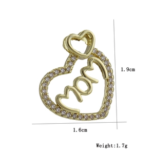 Detailed view of gold-plated heart pendant with MOM text and cubic zirconia micro-inlay