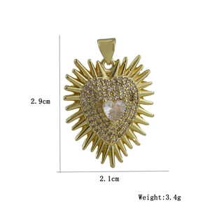 Detailed view of gold sunburst heart pendant with dimensions 2.9cm x 2.1cm and 3.4g weight