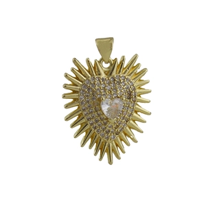 Detailed view of a gold heart pendant with zircon inlay and radiating spikes