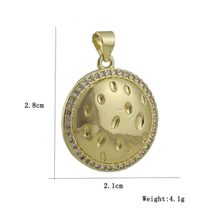 Macro detail of gold plated geometric charm with zircon inlay and 2.8cm size specs