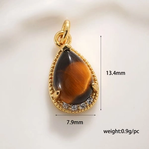 Macro view of teardrop tiger eye stone pendant with size measurements and gold plating