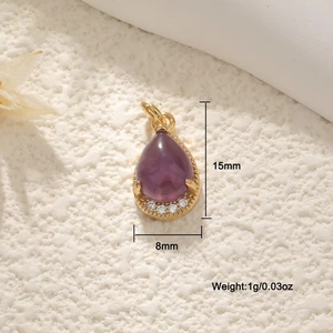 Macro detail of a 15mm purple teardrop pendant with gold plating and small diamonds