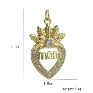 Detailed view of golden heart MOM pendant with zircons, dimensions 3.1cm by 1.8cm