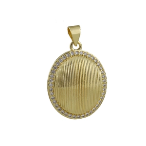 Close-up of oval gold pendant with vertical stripe relief and white zircon inlay
