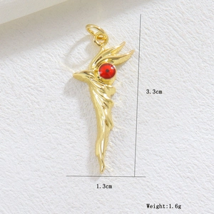 Detailed view of a golden wing pendant with red enamel eye and size measurements