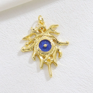 Artistic golden Evil Eye pendant with fluid metal design and blue star-textured center