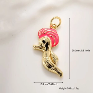 Detailed macro shot of golden seahorse jewelry charm with pink enamel and size measurements
