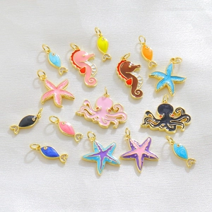 Macro shot of colorful sea creature alloy pendants including seahorse and starfish