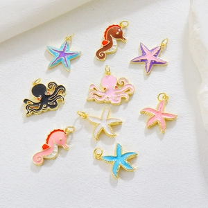 Detail showing assorted colorful enamel marine pendants like seahorses and starfish
