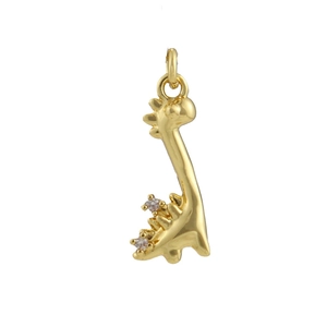 Detailed view of a golden dinosaur pendant with white zircon stones and polishing
