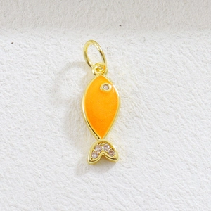 Detailed view of fish charm with orange enamel finish and sparkling cubic zirconia stones