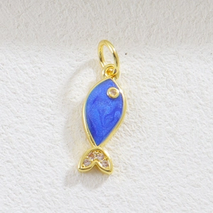 Detailed view of fish charm with blue enamel and zircon stones for DIY jewelry