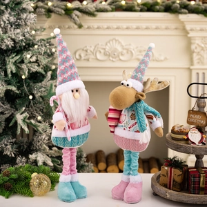 Pink and blue telescopic Christmas plush dolls featuring Santa and reindeer on a fireplace