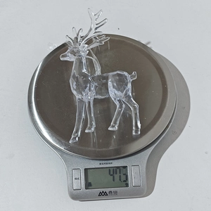Detailed view showing the clear acrylic Christmas reindeer ornament weighing 47.3 grams
