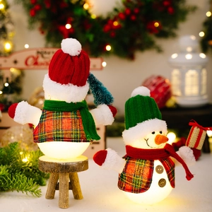 Lighted Christmas snowman figurines with warm LED glow and plaid vests for table decor