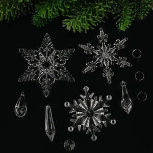 Sparkling crystal acrylic snowflake ornaments set for Christmas tree decoration on green pine