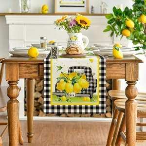 Detail view of farmhouse table runner with lemon clusters and black plaid truck patterns