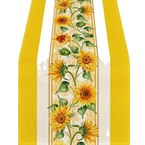 Summer table runner with bright yellow sunflowers and green leaves on white fabric