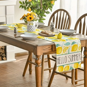 Hello Summer lemon table runner with bright citrus fruit prints and green leaf patterns