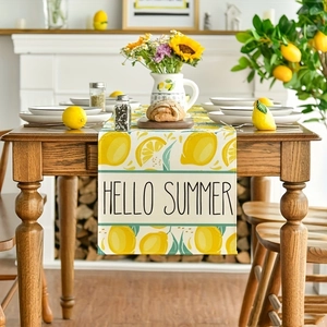 Hello Summer lemon table runner with yellow fruit pattern on a wooden dining table