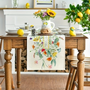 Linen table runner with colorful wildflower print on dark wood dining table