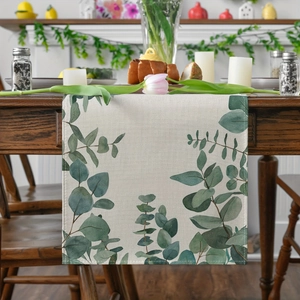Minimalist eucalyptus leaf table runner on a rustic wooden dining table for home decor
