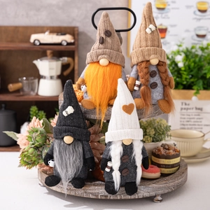 Set of four coffee gnome plush decorations with knitted hats on wooden display shelves