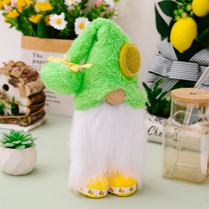 Detailed view of summer lemon gnome featuring a green plush hat and yellow bow accent