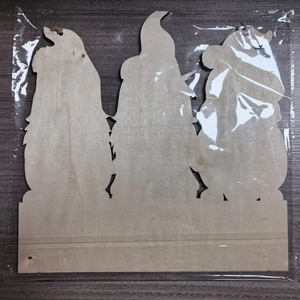 Detail of wooden summer ocean gnomes door sign with jute rope in protective packaging