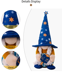 Détails du gnome de Hanoucca montrant le chapeau à étoiles et la broderie dreidel