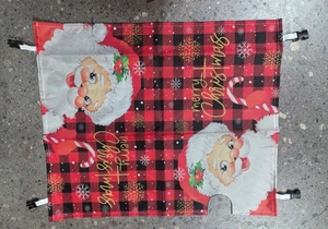 Detail of Christmas mailbox cover with Santa Claus print and red buffalo plaid fabric