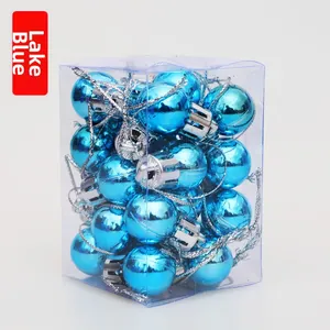 Close-up of lake blue 2cm Christmas ball ornaments in clear plastic packaging box